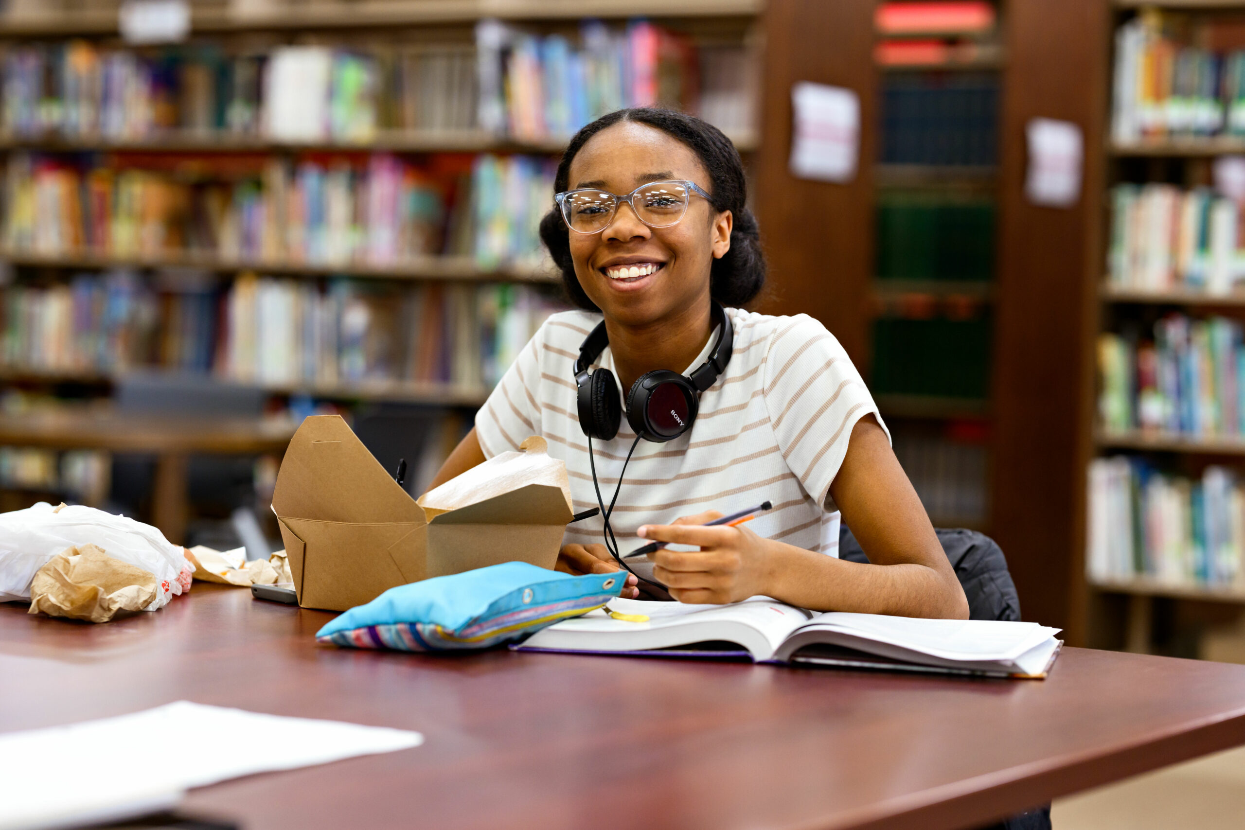 Photo of Lanai Sanford studying in the library.