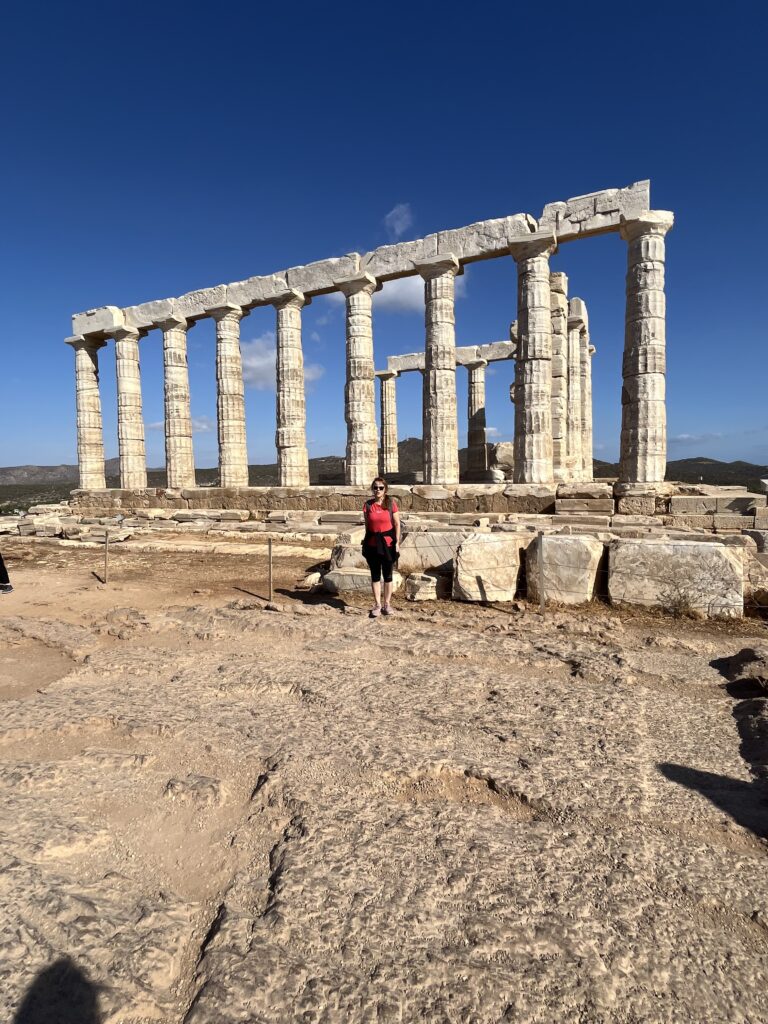 Photo of Dr. Lena Toews in front of ruins in Greece.