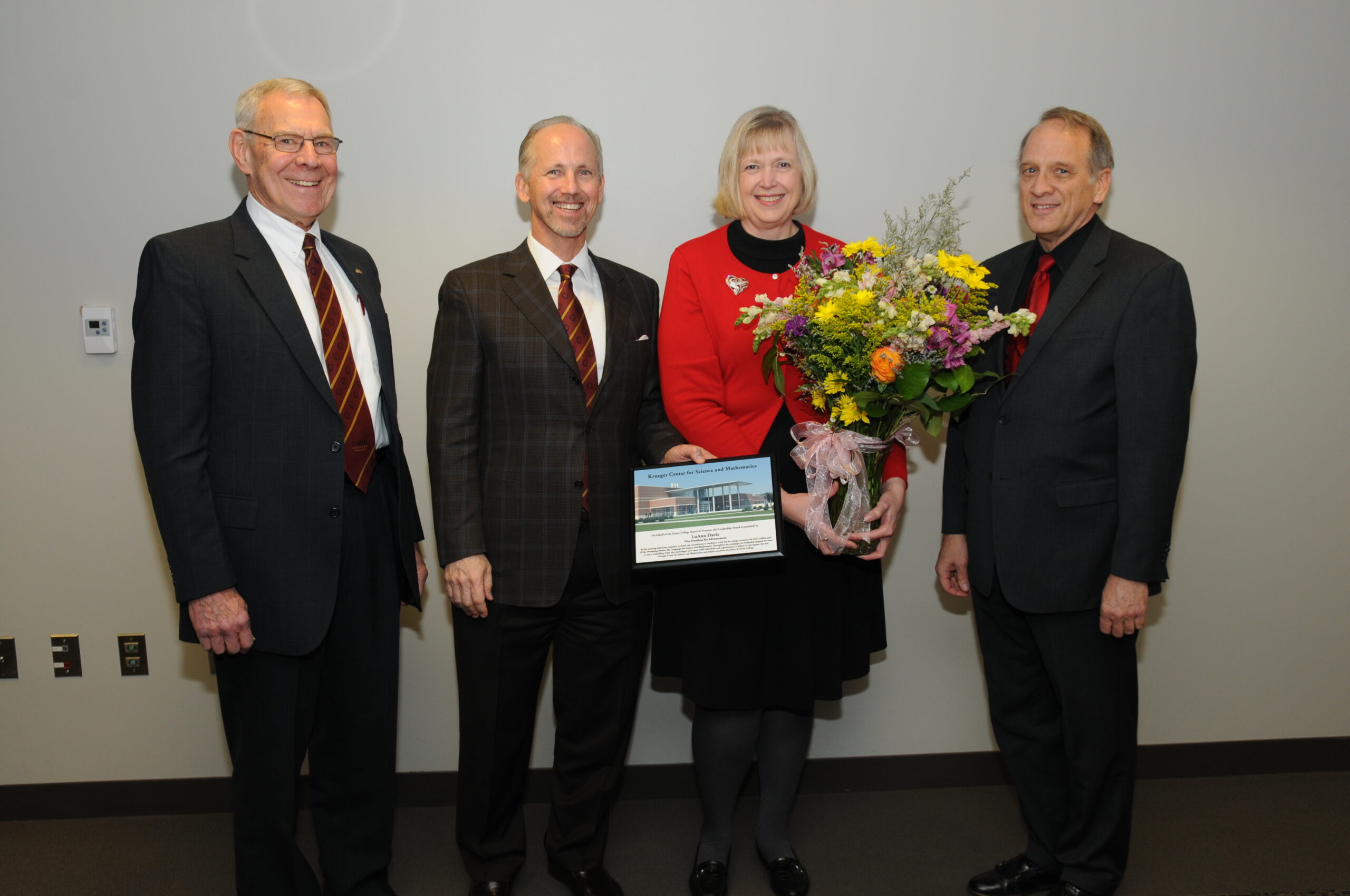 John Wagner, Kent Thompson and Tom Lemon present LuAnn with an award for her leadership in 2014